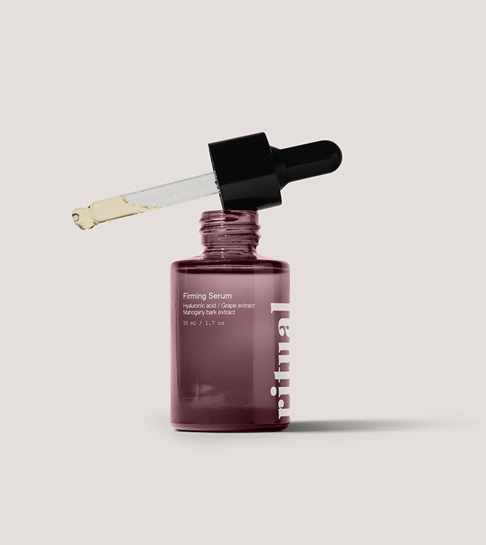 a bottle of serum with the lid open